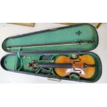 A late 19th century French 1/4 size violin, unlabelled, cased with a bow