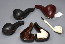 Four cased Meerschaum pipes and another unboxed