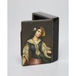 A papier mache snuff box with a portrait of a lady to the lid
