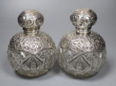 A pair of Edwardian repousse silver-mounted globular glass scent bottles, J.H. Worrel, Son & Co Ltd,