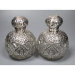 A pair of Edwardian repousse silver-mounted globular glass scent bottles, J.H. Worrel, Son & Co Ltd,