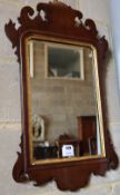 A small George III style mahogany fret cut wall mirror, width 40cm, height 70cm