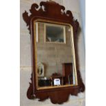 A small George III style mahogany fret cut wall mirror, width 40cm, height 70cm