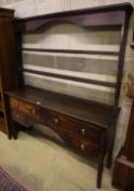 A 19th century oak dresser with open plate rack, width 152cm, depth 41cm, height 181cm