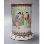 A Chinese cylindrical porcelain brush pot, enamelled with female figures and script,