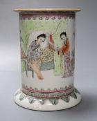 A Chinese cylindrical porcelain brush pot, enamelled with female figures and script,