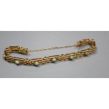 An Edwardian 9ct and nine stone turquoise set gatelink bracelet, approx. 17.5cm, gross 12.1 grams (