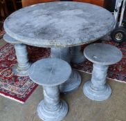 A circular reconstituted stone garden table, 100cm diameter, 80cm high and four matching stools,