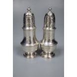 A matched pair of George I and George II silver pepperettes, Thomas Bamford, London, 1723 & 1728,