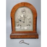 An Edwardian eight day birds eye maple cased mantel clock, with chiming movement, retailed by