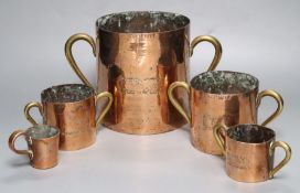 Five 19th century graduated copper measures, tallest 17cm