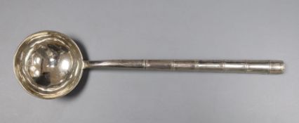 An early 20th century Chinese Export white metal ladle, with faux bamboo handle, Wing Nam & Co, 18.