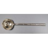 An early 20th century Chinese Export white metal ladle, with faux bamboo handle, Wing Nam & Co, 18.