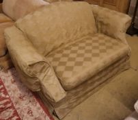 A small upholstered two seater camel back settee with loose pale green cover, length 150cm, depth