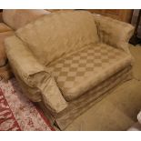 A small upholstered two seater camel back settee with loose pale green cover, length 150cm, depth