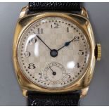 A gentleman's early 1930's 9ct gold manual wind wrist watch, with checkered dial, on later strap.