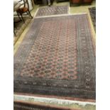 A Bokhara red ground small carpet, a pink ground runner and two other rugs (4), largest 320 x 222cm