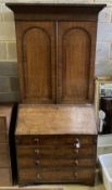 A George III oak bureau bookcase, width 98cm, depth 52cm, height 219cm