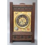 A French Aesthetic style oak mantel clock with enamelled ceramic dial, gong striking movement,