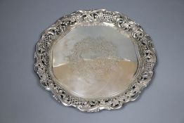 A late Victorian engraved silver waiter, with pierced border, Birmingham 1898, by Henry Matthews,