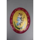 A Continental oval porcelain plaque depicting a girl, height 12.5cm
