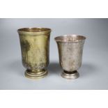 An 18th century French white metal beaker, 94mm and a later gilt white metal French beaker, 11.