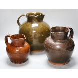 Three various 19th century Sussex terracotta flagons, largest 28cmCONDITION: Largest jug - some