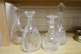 A silver Jubilee 1977 commemorative etched decanter and stopper and three other glass decanters,