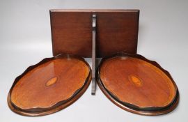 A pair of small inlaid oval mahogany trays, 31cm and a Chippendale style mahogany wall bracket, 27cm