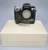 A Nikon F5 SLR camera body in original 50th Anniversary model boxed, virtually mint