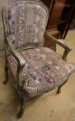 A French painted upholstered open armchair