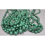 Ten assorted single strand malachite bead necklaces, two with gilt metal spacers, largest 64cm.