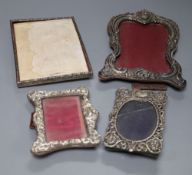 Two late Victorian silver mounted photograph frames, largest 20.3cm, a similar Edwardian frame and a