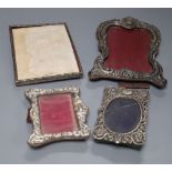 Two late Victorian silver mounted photograph frames, largest 20.3cm, a similar Edwardian frame and a