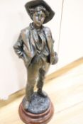 After H. Wiesse. A large patinated spelter figure of a fruit picker entitled "Siffleur" signed,