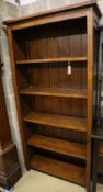 A modern stained pine open shelved bookcase, width 98cm depth 33cm height 198cm