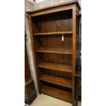 A modern stained pine open shelved bookcase, width 98cm depth 33cm height 198cm