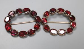 A pair of early 19th century yellow metal overlaid and garnet set oval shoe buckles, 39mm, gross