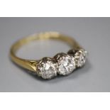 An 18ct and plat set three stone diamond ring, size M/N, gross 2.8 grams, the largest approx. 5mm in