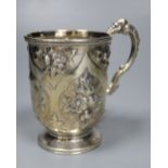 A Victorian embossed silver christening mug, George Adams, London, 1875, 10.7cm, 142 grams.