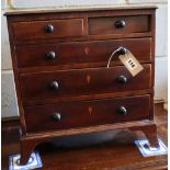 A George IV inlaid mahogany apprentice chest of drawers, width 42cm, depth 20cm, height 44cm