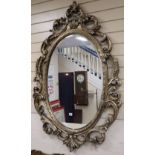 A Victorian style oval wall mirror, 90 x 136cm