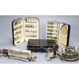 Three early 20th century fly fishing boxes containing flies, lures and line, two by Hardy and