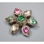 A 19th century white metal emerald, rose cut diamond and foil backed ruby? set flower head brooch,