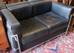 A pair of Corbusier style black leather and chrome two seater sofas, length 130cm, depth 66cm,