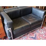 A pair of Corbusier style black leather and chrome two seater sofas, length 130cm, depth 66cm,