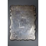 An Edwardian engraved silver card case, Birmingham, 1909, 94mm.CONDITION: Small bump to one corner