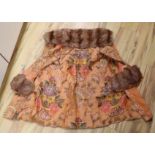 A 1930's orange brocade floral fur trimmed coat label Delia, 99 New Bond Street