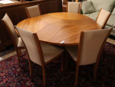 Skovby, Denmark, a patent cherrywood revolving expanding circular table with three integral