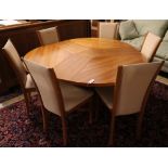 Skovby, Denmark, a patent cherrywood revolving expanding circular table with three integral